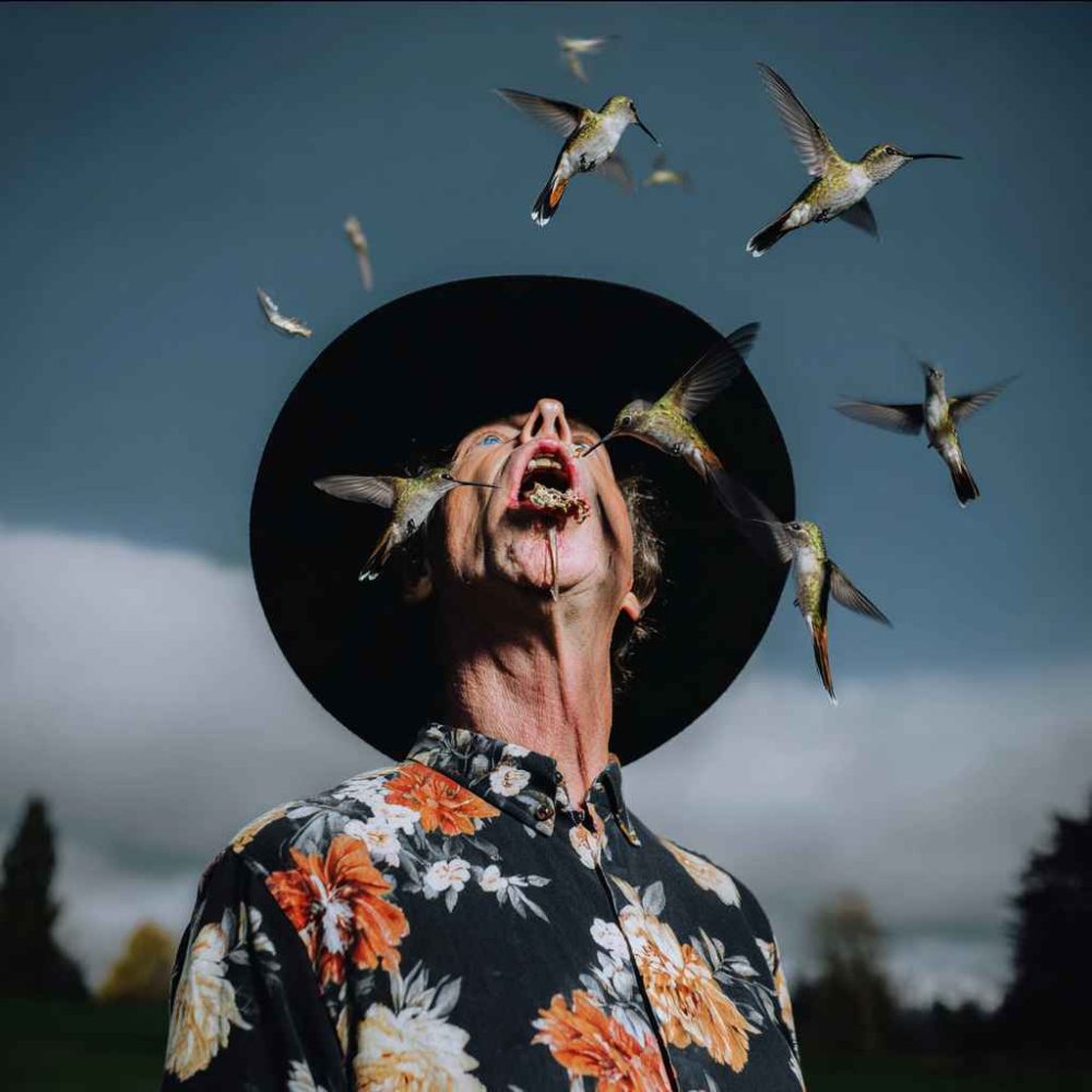 julis29_a_man_with_a_black_hat_looking_up_with_his_mouth_open_b1612e70-1ef7-4292-a326-73cb6a5b0d29_0_10_11zon